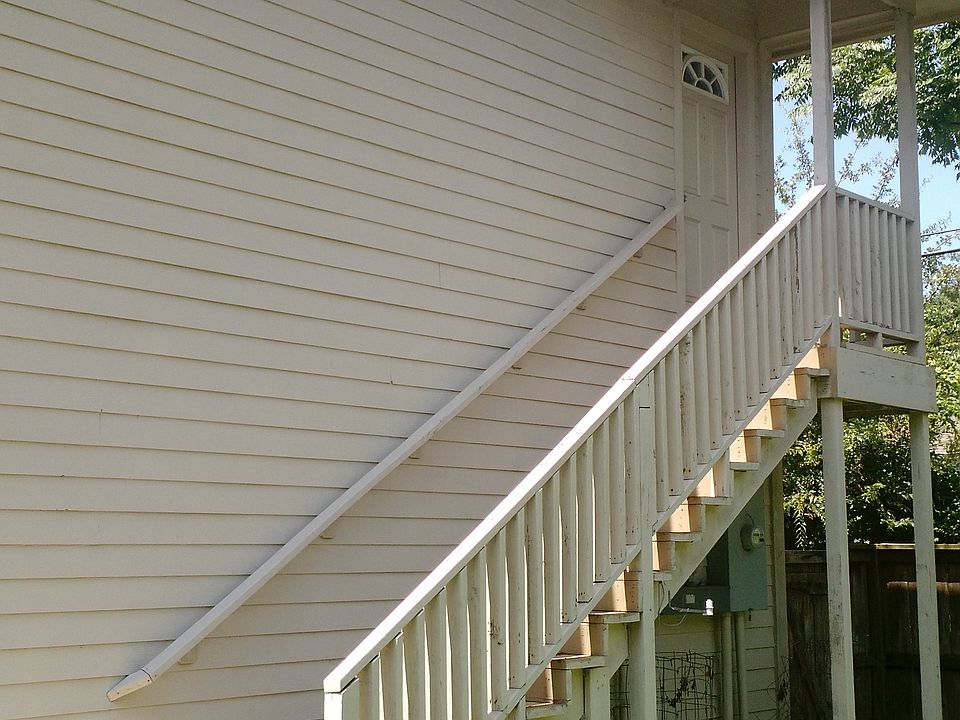 Exterior view of staircase leading to second-floor apartment