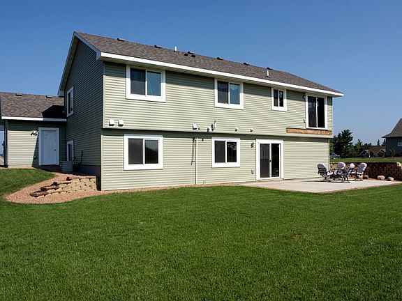 Backyard features an in-ground irrigation system/ new brick retaining wall.