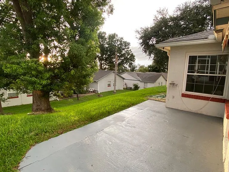 Private back porch with shade tree