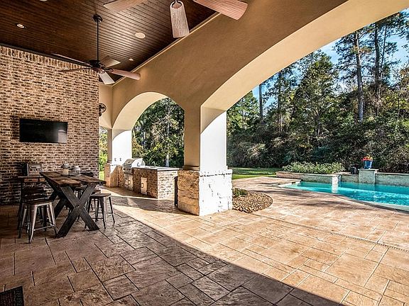 Grill, Sink, and Storage area at outdoor kitchen.