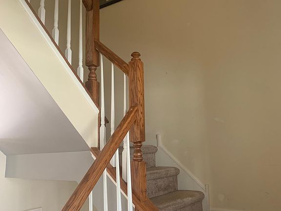 Stairs from main living area going upstairs to 3 BR's and full Bath.