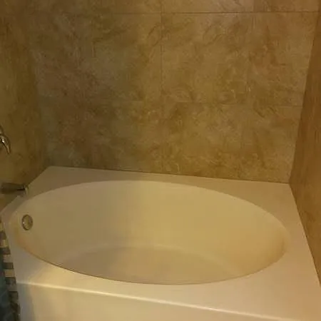 Master Roman tub with upgraded surround tub tile
