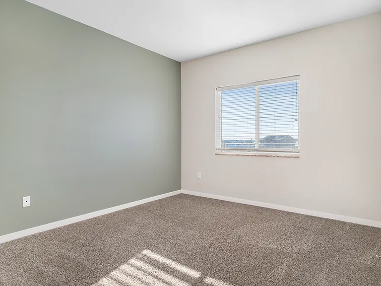 Bright and airy room with soft carpet, fresh paint, and a large window offering scenic views. Bright and airy room with soft carpet, fresh paint, and a large window offering scenic views.