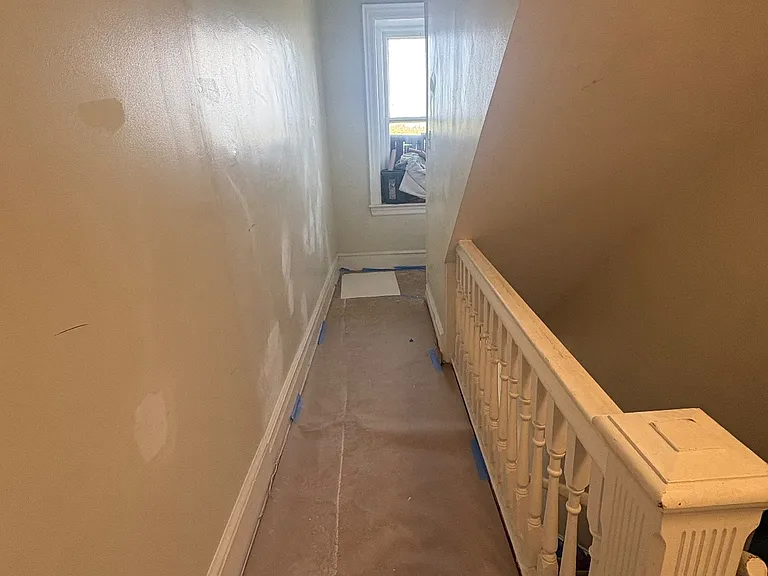 Entrance to apartment door, floors have been redone
