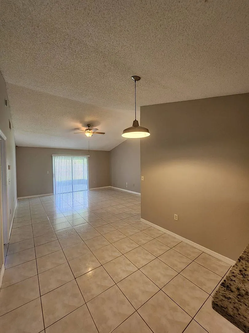 Move-In Ready Poinciana Gem with a Brand-New Kitchen & Screened Porch! — Photo 2