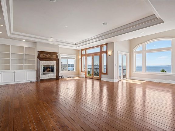 Large Living Room/ Great Room with Custom Built Shelving for the Avid Reader & Collector
