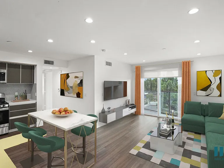 Open-Concept Kitchen, Dining, and Living Room Space with a Patio