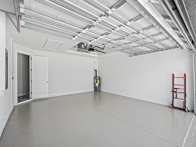 Spacious 2 Car Garage with epoxy floor. Garage door opener