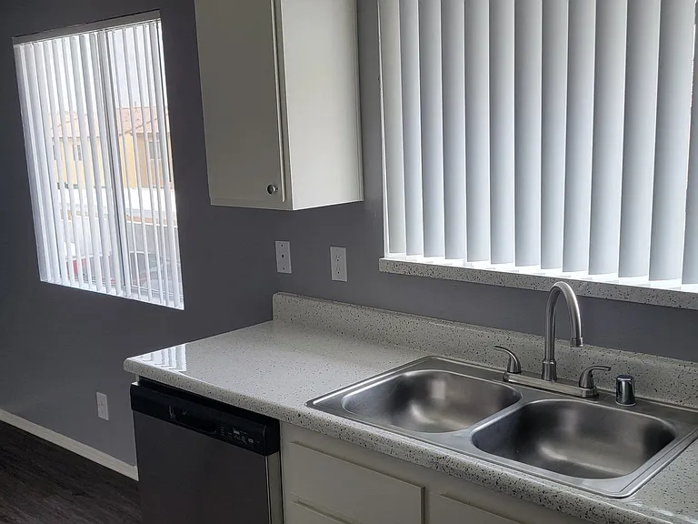 Lots of natural light in the kitchen and dining room at Grand Oaks Apartments in Lake Elsinore, California.
