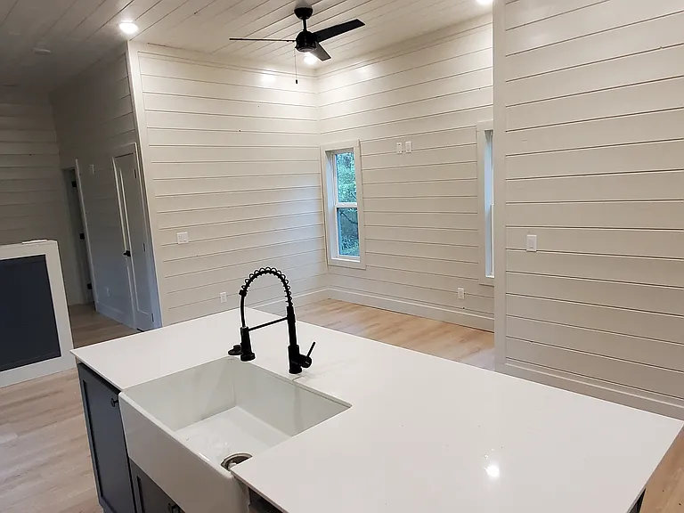 Farmhouse kitchen sink + dishwasher.