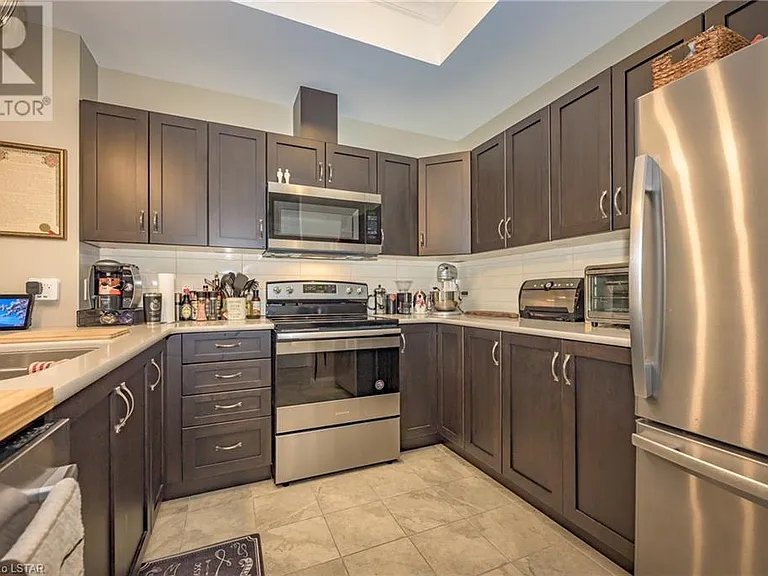 Stainless Steel Appliances. Granite Countertops.
