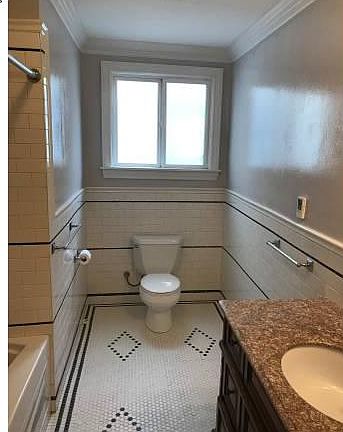 Beautifully tiled full bathroom with lots of light