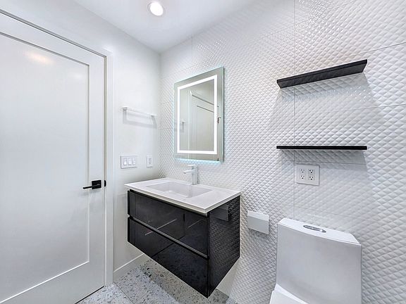 designers bathroom with premium fixtures