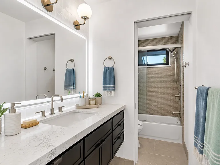 This is a 2nd floor bathroom adjacent to the potential kids room complete with tub and lots of storage.
