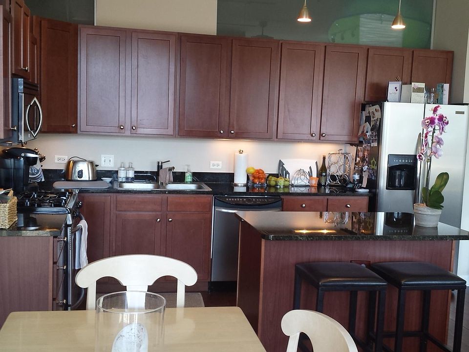 Open granite and stainless steel kitchen with island