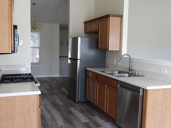 View of kitchen, dining room and living room from the breakfast area which is adjacent to the elevated deck.