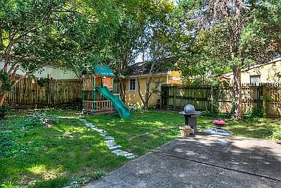 Back patio with white granite steps to side garage entrance. 2 A/C units. One for upstairs and one for main level to keep utility bills down.