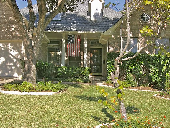 Main entry under canopy of oaks