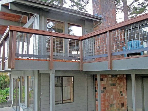 The home from the water side, plenty of new deck area wraps around.