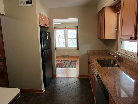 Kitchen, with granite tops, tile floors and upgraded applian