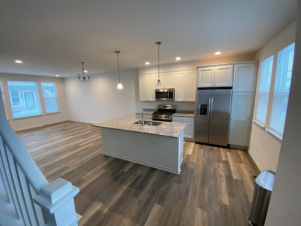 Gorgeous kitchen with stainless steel appliance, granite countertop and hardwood flooring