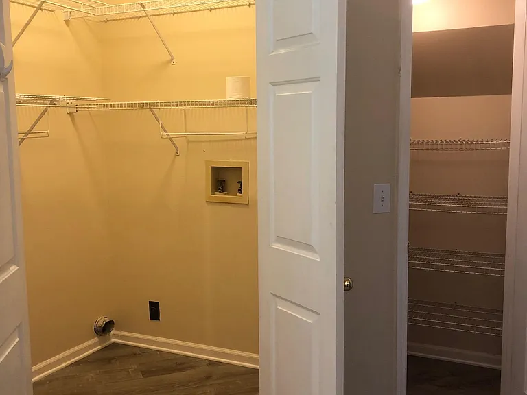 laundry and pantry next to kitchen