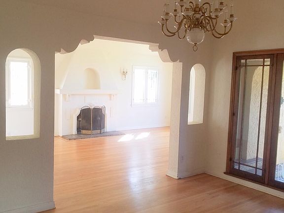 formal dining room with view into living room. Wood burning fireplace.
