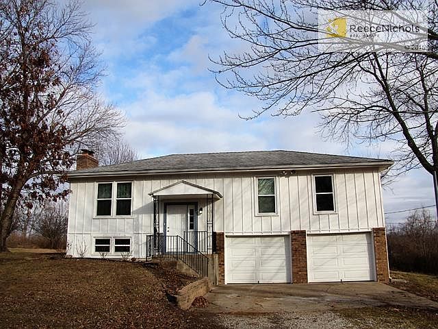 Darling, updated Split on 6+ acres in Edwardsville.  Freshly painted & new carpet throughout.  Move In Ready.
