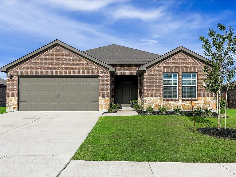 Brick and stone facade residence featuring a dark gray garage trim and nice covered entryway.