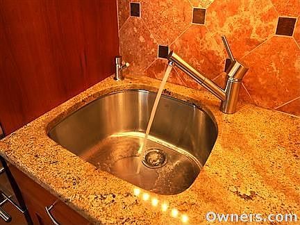 Stainless steel sink, KWC pull-out faucet, granite & marble.