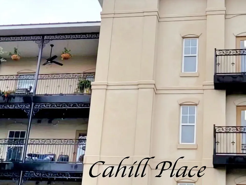 Cahill Place luxury living with French Quarter flare. Front units feature a large balcony, with entrance through french doors in living room.