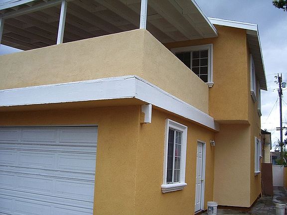 Back of units. 2 car garage, Balcony, newer built in back.