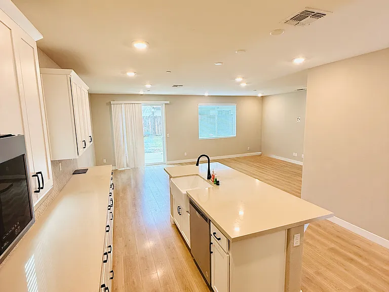 Kitchen with backyard door & window view