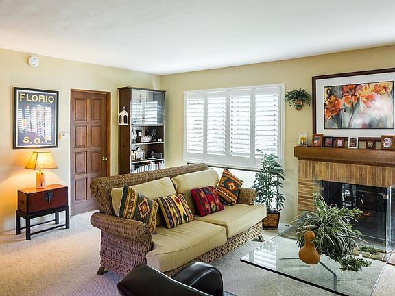 Living Room showing office or 2nd bedroom/bath door