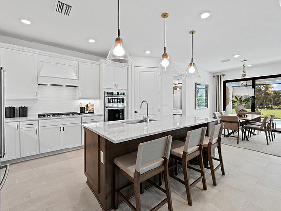 Kitchen with decorative back-splash and large center island
