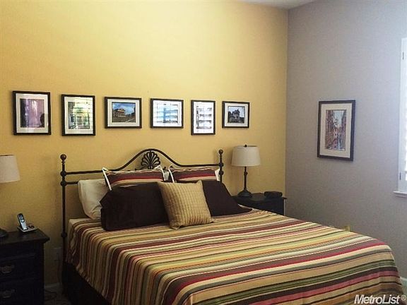 Master bedroom has sliding door to back covered patio