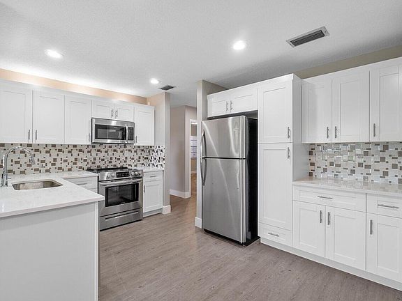4th image of 5690 Princess Palm Court #D