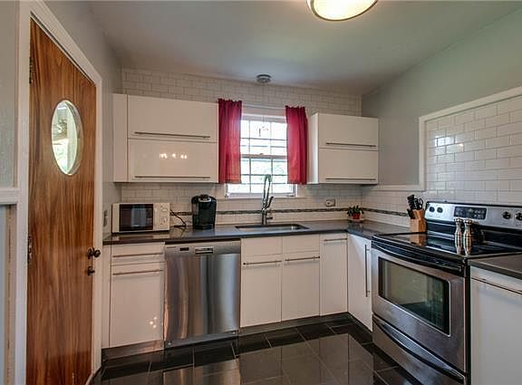 Updated kitchen with stainless steel appliances and heated floors