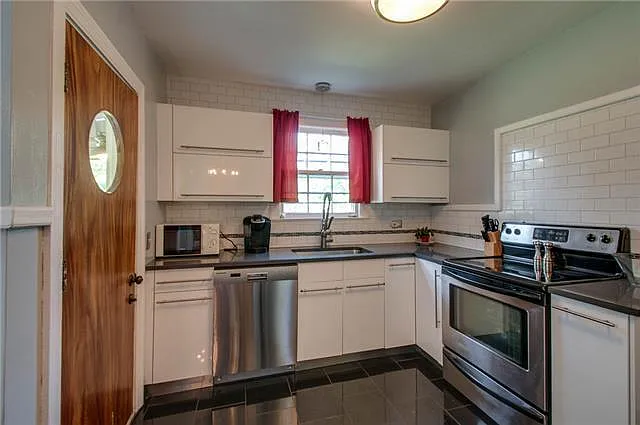 Updated kitchen with stainless steel appliances and heated floors