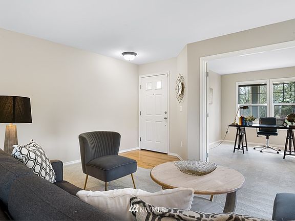 Another view of formal living room & office/den.