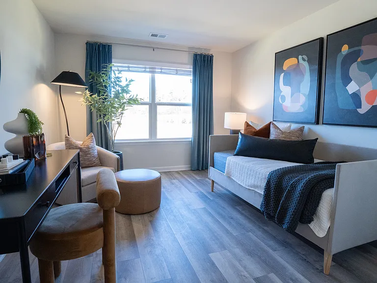 Additional bedroom on the second floor, set up like an office/guest bed with the pull out couch. Large window letting in natural light.