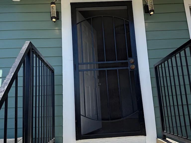 Side entrance with new lighting fixtures and fresh paint