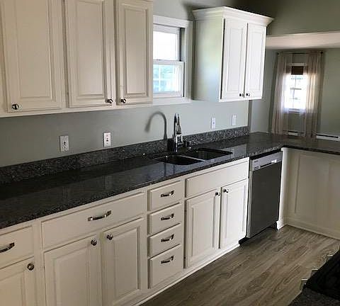 Kitchen, white cabinets, Samsung appliances, Granite countertops.