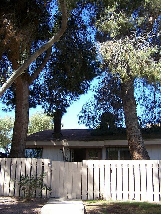 Back fenced, shaded patio