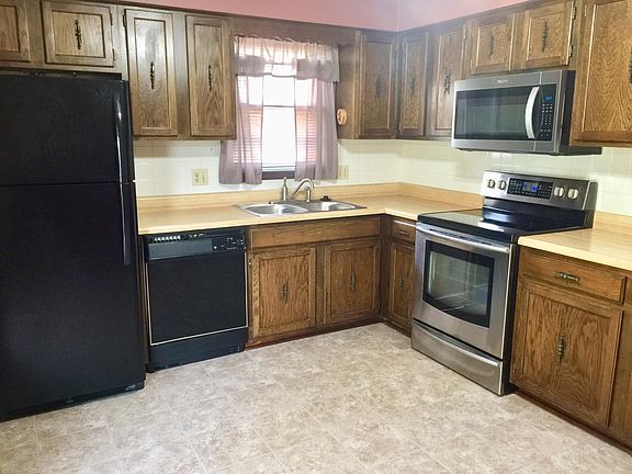 Kitchen with appliances; (new refrigerator, microwave, sink,