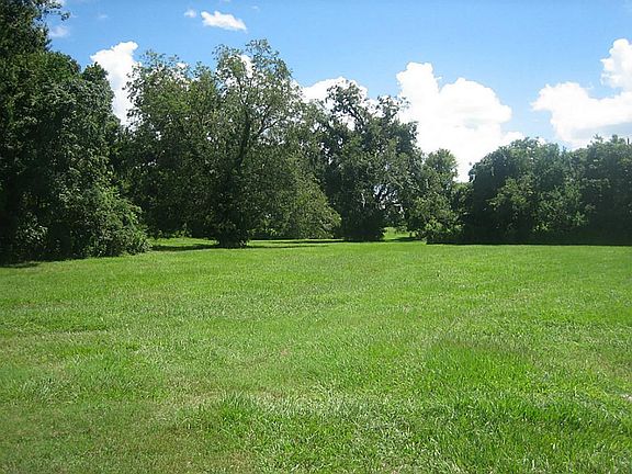 9731 Thompson Lake Dr, a 6 acre cul-de-sac lot in prestigious Sienna Point.