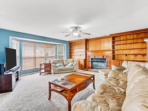Family room with build in book cases and bay window