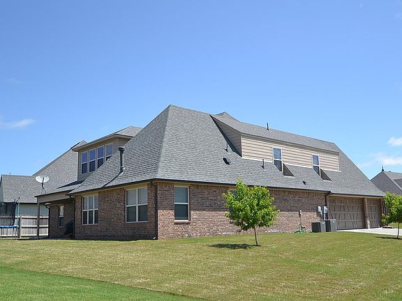 Full brick exterior with 3 car side-entry garage