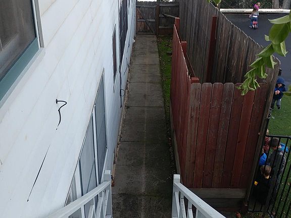 Apartment is on the second story with a private staircase leading to its front door. There is a small side yard---gardening permitted here.