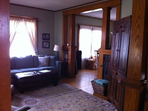 livingroom with built-in leaded glass bookshelves